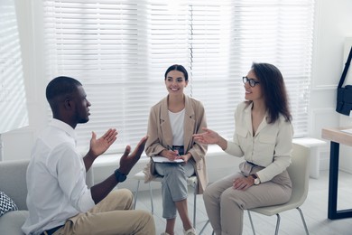 Job interview with new coworker in office Photo of Job interview with new coworker in office