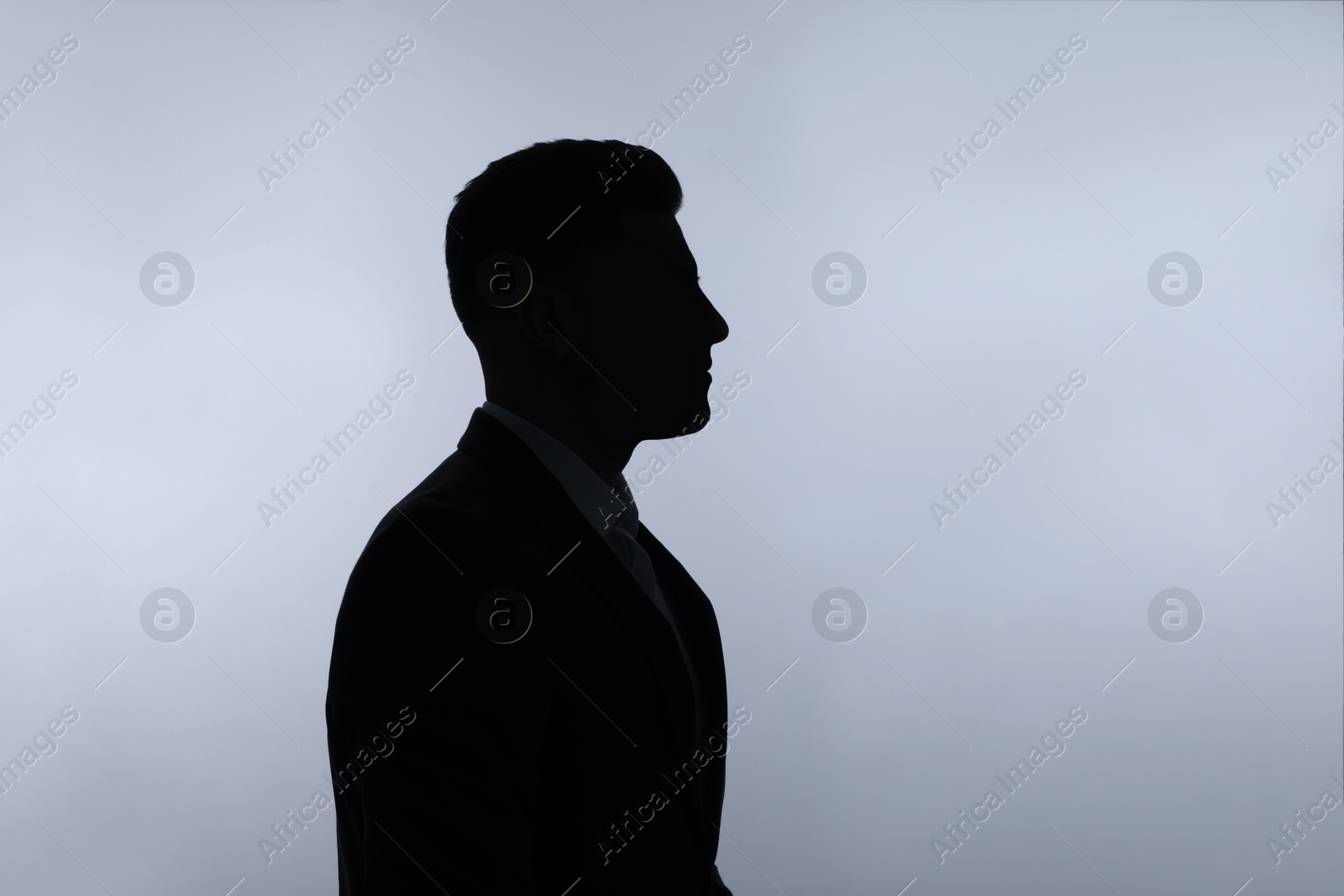 Silhouette of anonymous man on white background Photo of Silhouette of anonymous man on white background