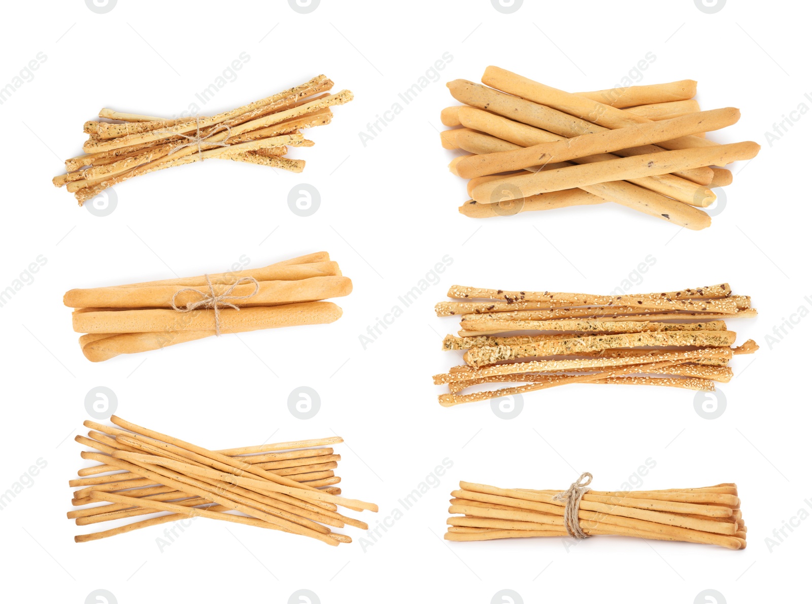 Set with delicious crispy grissini sticks on white background Image of Set with delicious crispy grissini sticks on white background