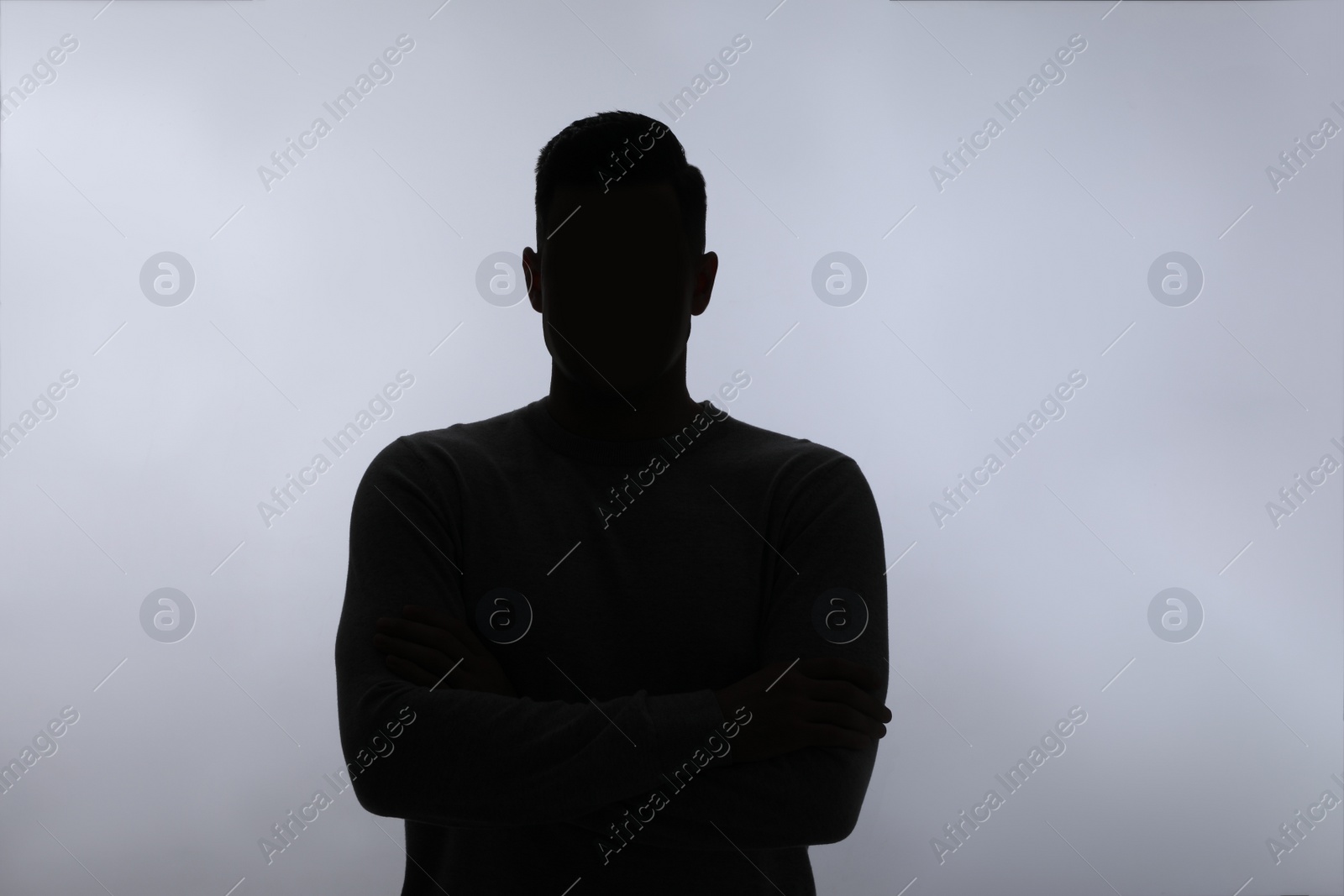 Silhouette of anonymous man on white background Photo of Silhouette of anonymous man on white background