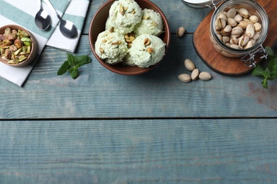 Delicious pistachio ice cream served on blue wooden table, flat lay. Space for text Photo of Delicious pistachio ice cream served on blue wooden table, flat lay. Space for text