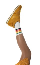 Woman wearing sneakers on white background, closeup Photo of Woman wearing sneakers on white background, closeup