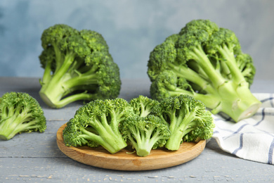 Fresh green broccoli on wooden table. Organic food Photo of Fresh green broccoli on wooden table. Organic food