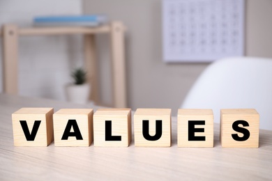 Cubes with word VALUES on wooden table Photo of Cubes with word VALUES on wooden table