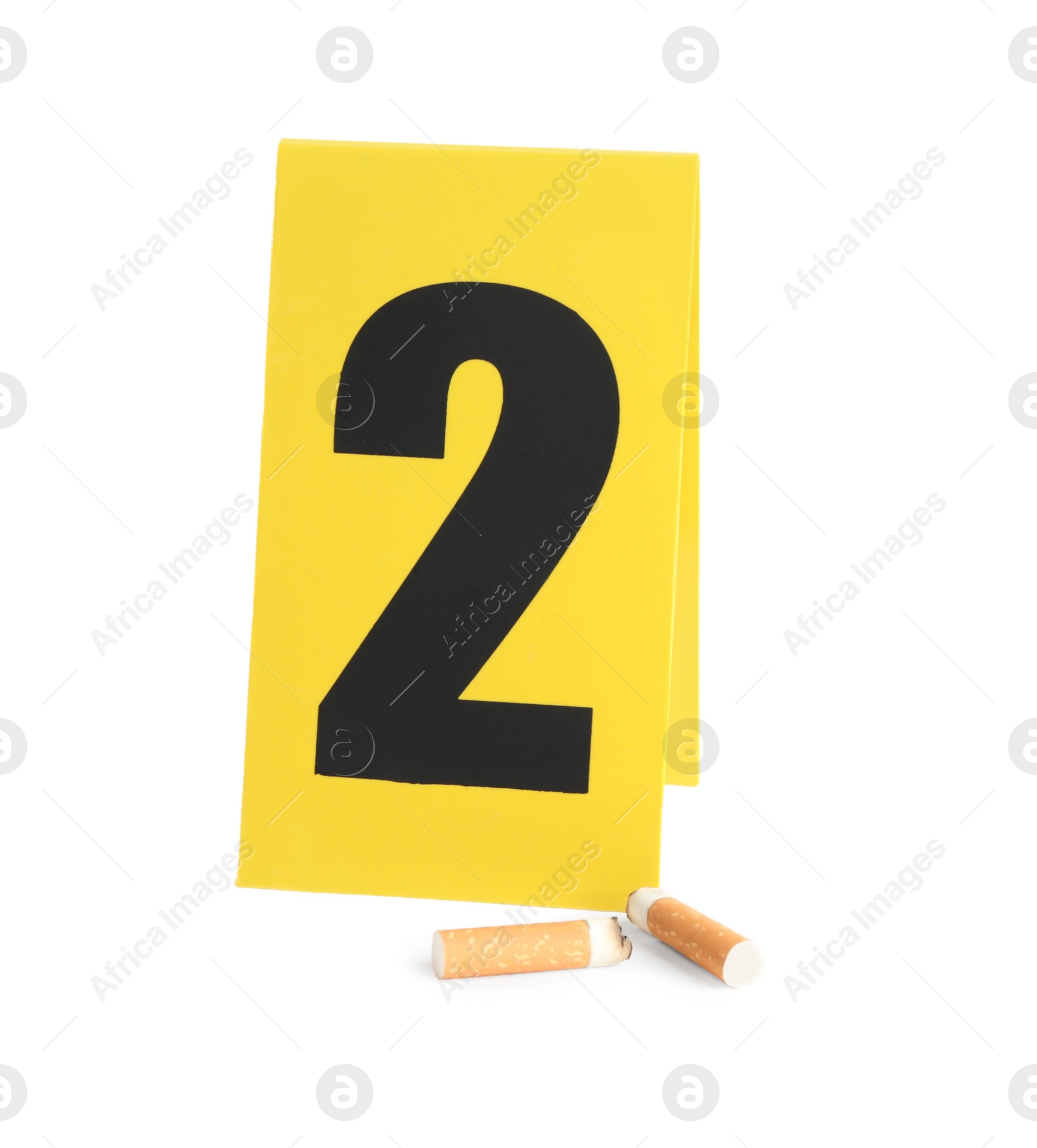 Cigarette stubs and crime scene marker with number two isolated on white Photo of Cigarette stubs and crime scene marker with number two isolated on white
