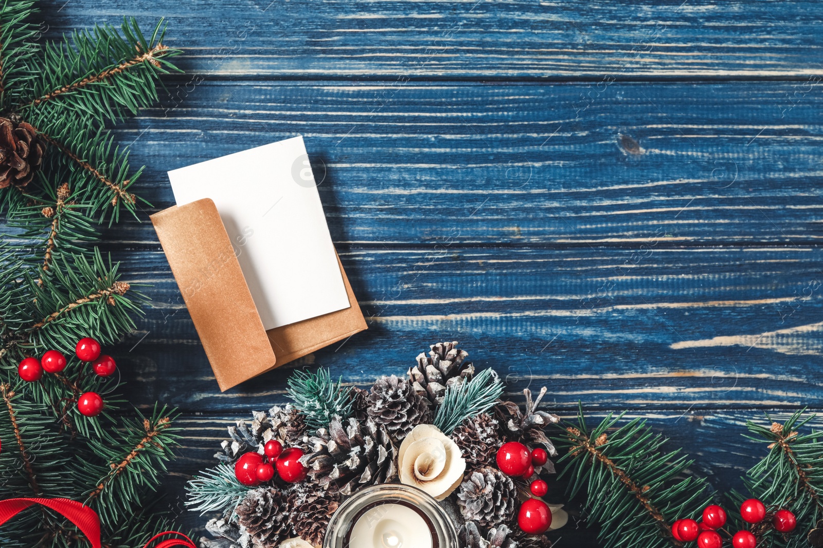 Flat lay composition with blank greeting card and Christmas decor on blue wooden table, space for text Photo of Flat lay composition with blank greeting card and Christmas decor on blue wooden table, space for text