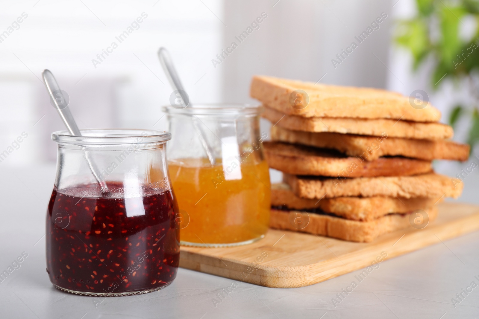 Toasts and jams for breakfast on table Image of Toasts and jams for breakfast on table