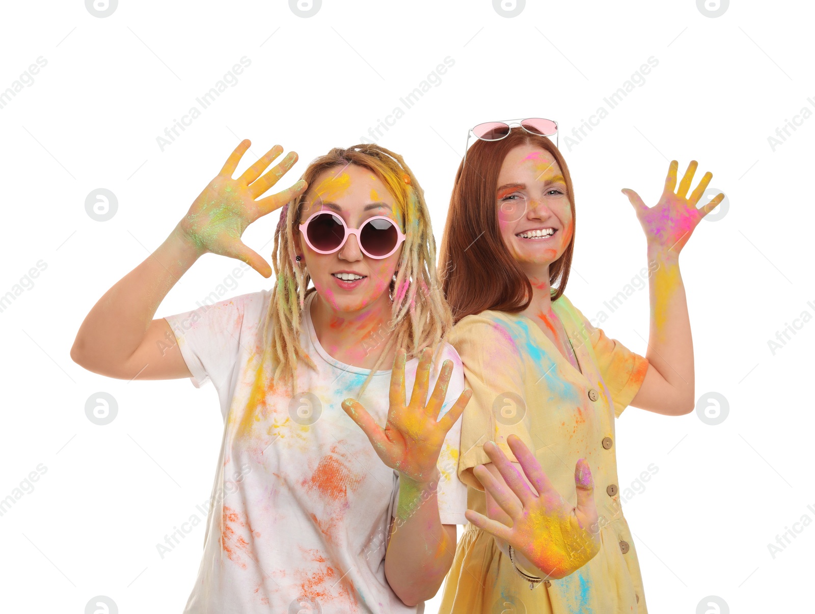 Women covered with colorful powder dyes on white background. Holi festival celebration Photo of Women covered with colorful powder dyes on white background. Holi festival celebration