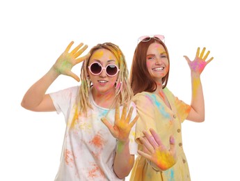 Women covered with colorful powder dyes on white background. Holi festival celebration Photo of Women covered with colorful powder dyes on white background. Holi festival celebration