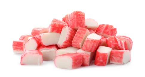 Many pieces of crab sticks on white background Photo of Many pieces of crab sticks on white background