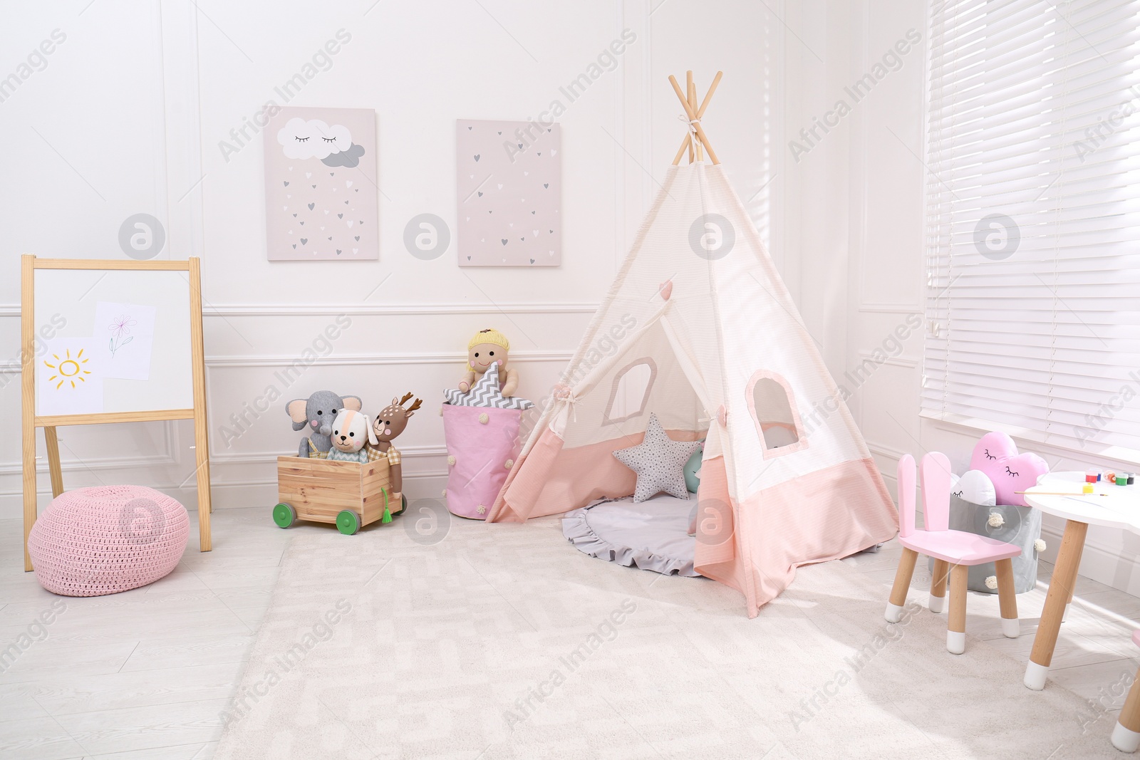 Cute child's room interior with toys, modern furniture and play tent Photo of Cute child's room interior with toys, modern furniture and play tent