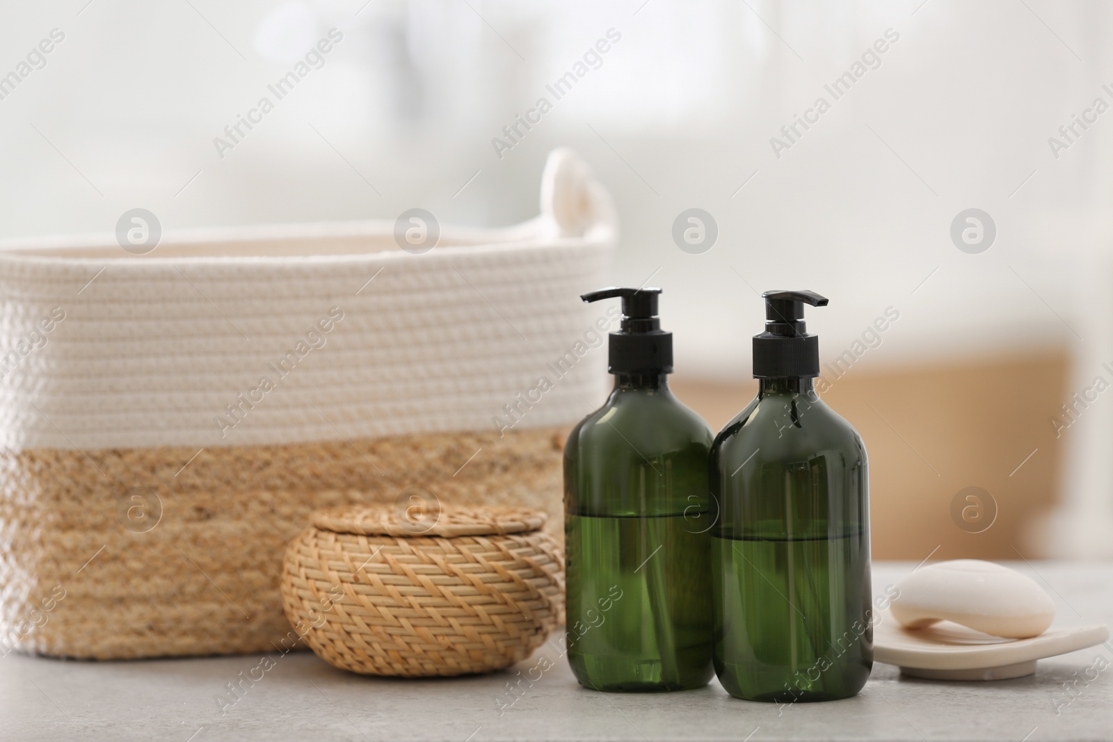 Green soap dispensers on white countertop in bathroom Photo of Green soap dispensers on white countertop in bathroom