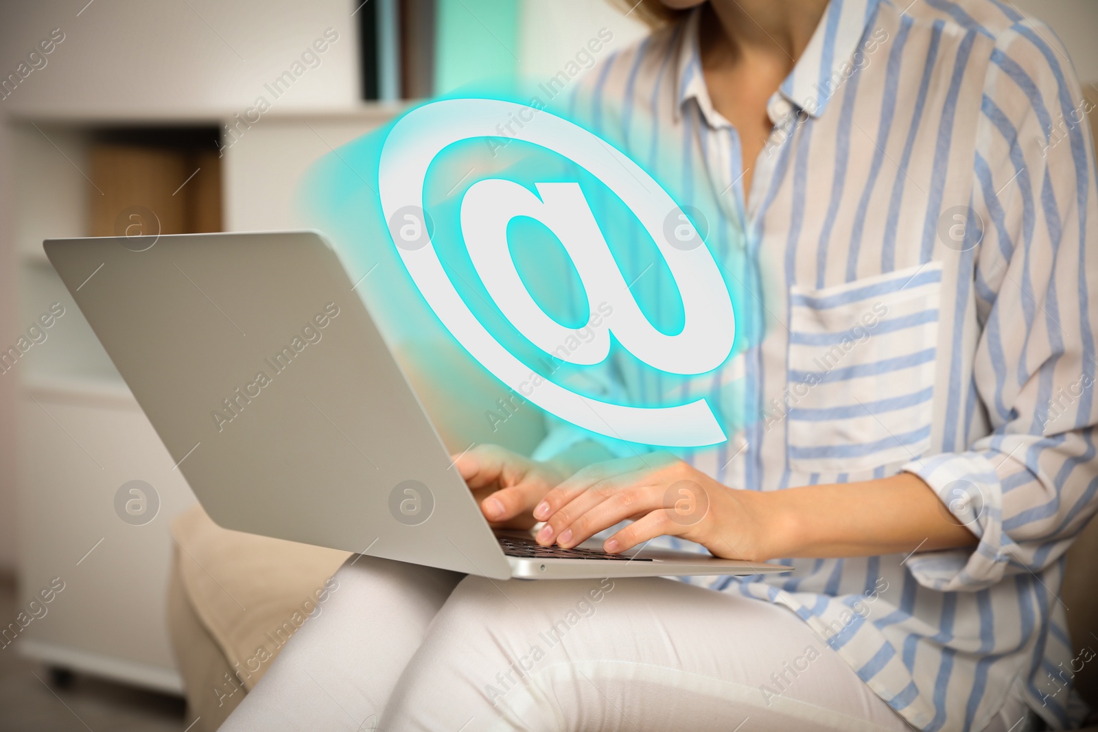 At sign illustration and woman sending email via laptop indoors, closeup Image of At sign illustration and woman sending email via laptop indoors, closeup