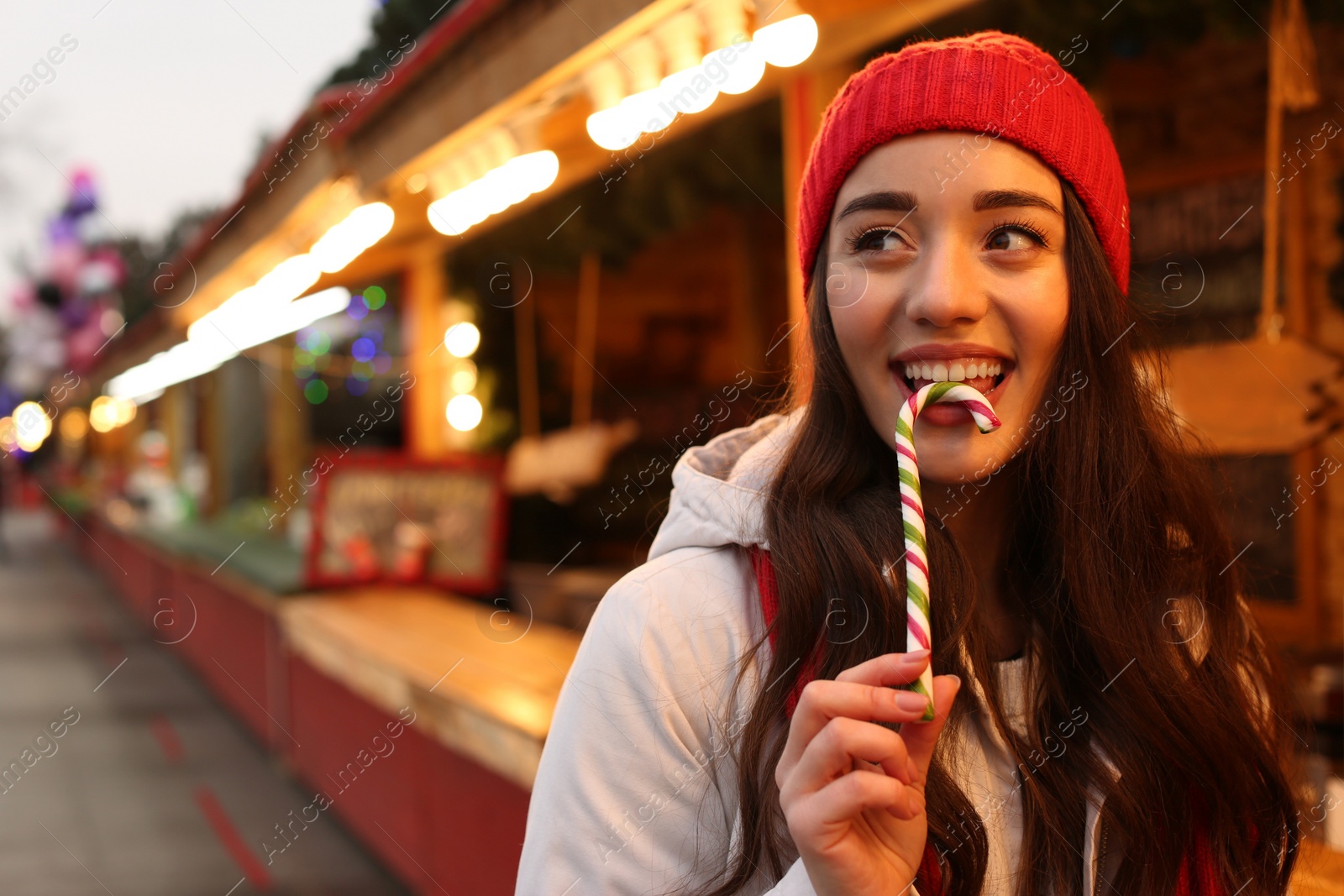 Young woman spending time at Christmas fair, space for text Photo of Young woman spending time at Christmas fair, space for text