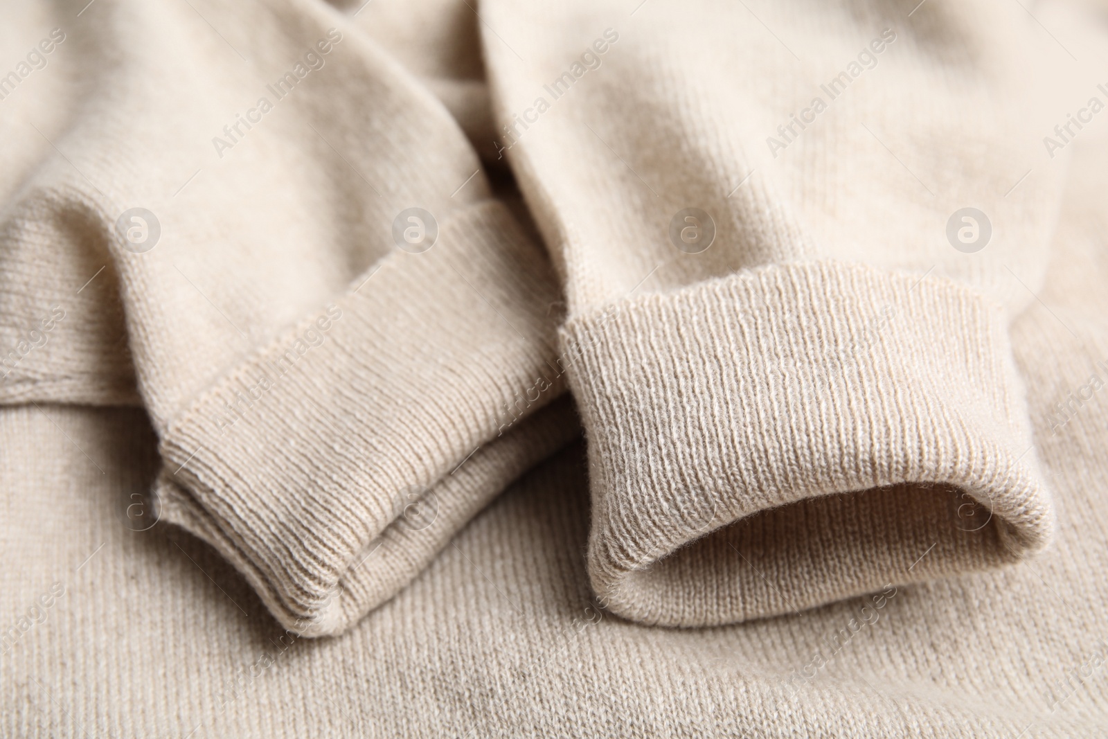 Warm cashmere sweater as background, closeup view Photo of Warm cashmere sweater as background, closeup view