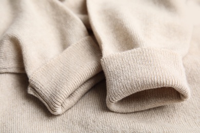 Warm cashmere sweater as background, closeup view Photo of Warm cashmere sweater as background, closeup view