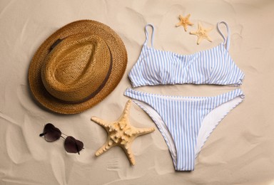 Flat lay composition with beach objects on sand Photo of Flat lay composition with beach objects on sand