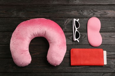 Flat lay composition with pink travel pillow on wooden background Image of Flat lay composition with pink travel pillow on wooden background