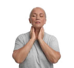 Mature woman doing thyroid self examination on white background Photo of Mature woman doing thyroid self examination on white background