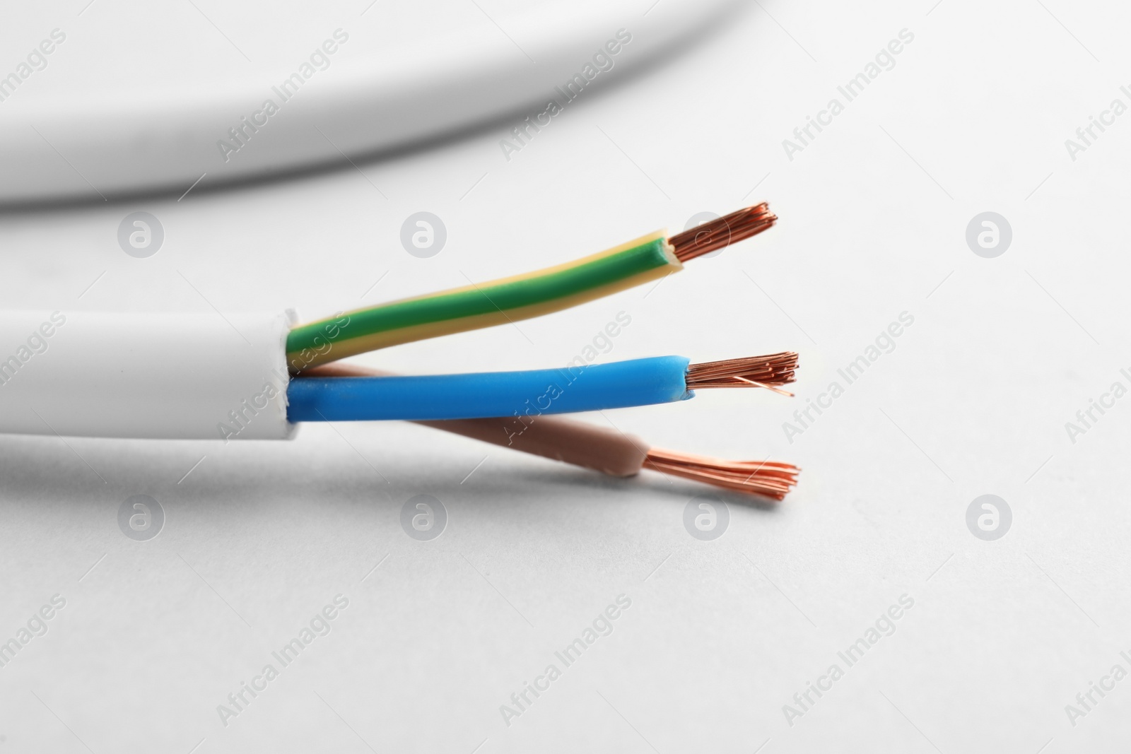 Closeup view of electrical power cables on white background Photo of Closeup view of electrical power cables on white background