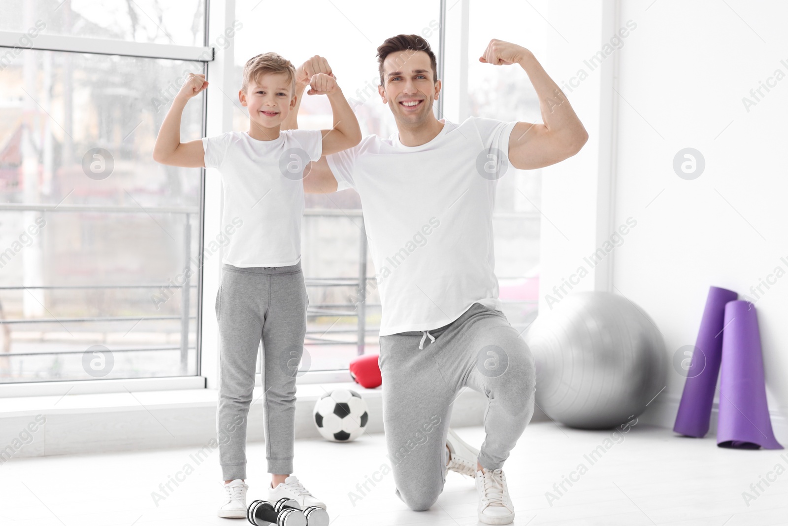Dad and his son in gym Photo of Dad and his son in gym