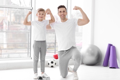 Photo of Dad and his son in gym