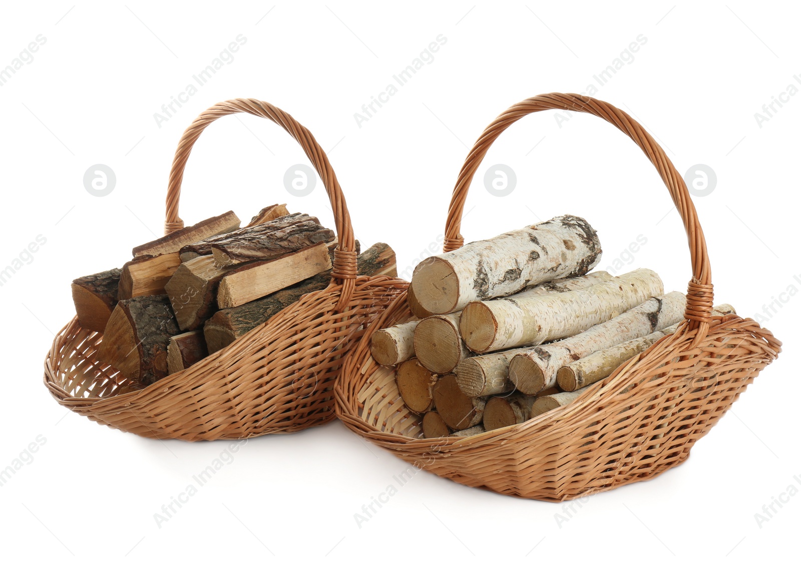 Wicker baskets with firewood on white background Photo of Wicker baskets with firewood on white background