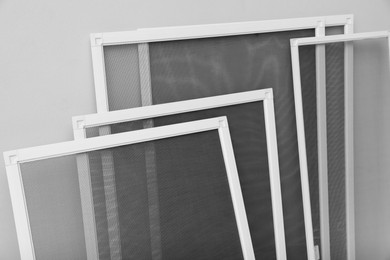 Set of window screens on light grey background Photo of Set of window screens on light grey background