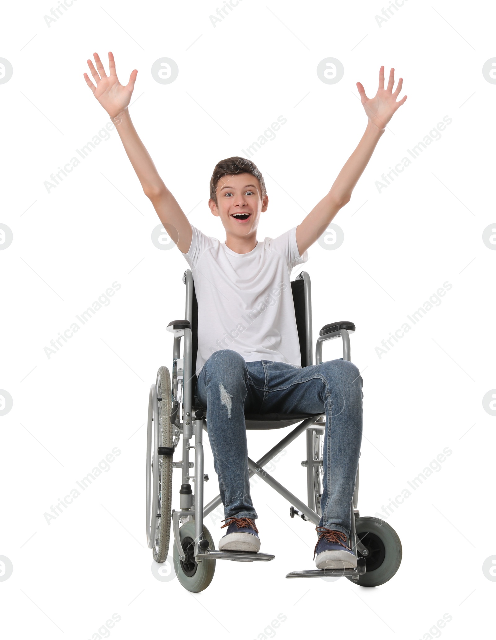 Emotional teen boy in wheelchair on white background Photo of Emotional teen boy in wheelchair on white background