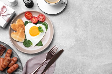 Romantic breakfast on light grey table, flat lay with space for text. Valentine's day celebration Photo of Romantic breakfast on light grey table, flat lay with space for text. Valentine's day celebration
