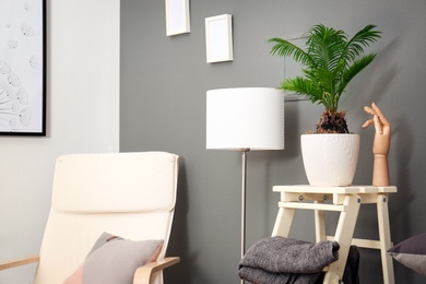 Stylish interior design with tropical leaves Photo of Stylish interior design with tropical leaves