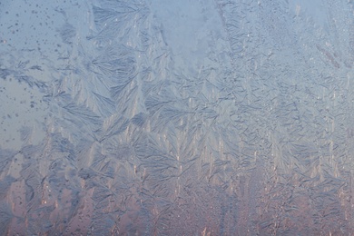Photo of Beautiful frosty window as background, closeup. Winter morning