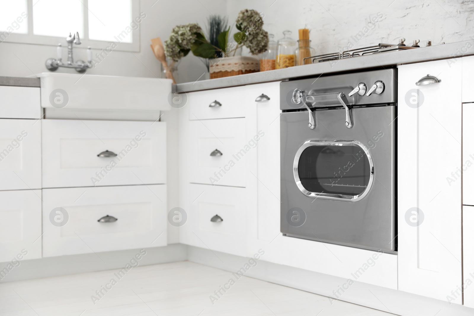 New modern oven in stylish kitchen. Cooking appliance Photo of New modern oven in stylish kitchen. Cooking appliance
