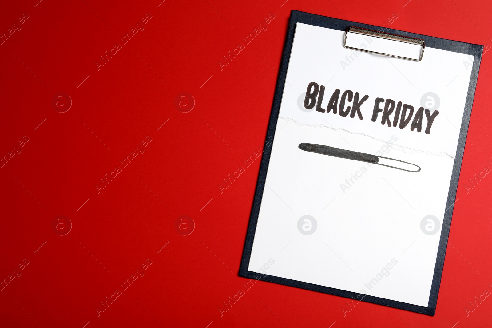Clipboard with phrase Black Friday on red background, top view. Space for text Photo of Clipboard with phrase Black Friday on red background, top view. Space for text