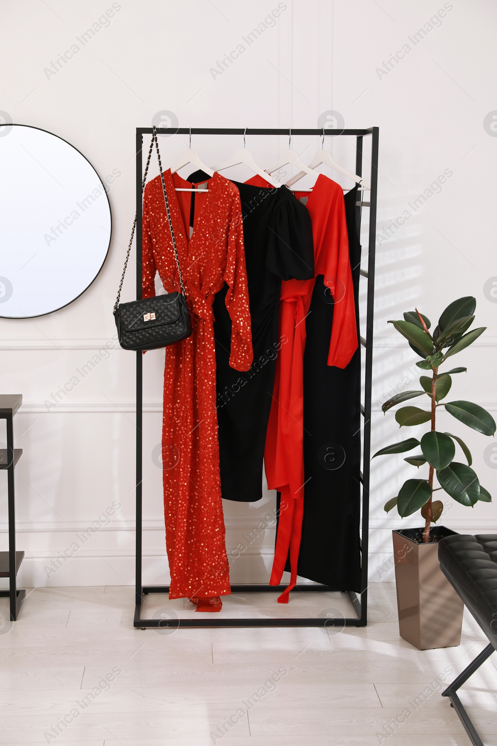 Collection of trendy women's garments in clothing rental salon Photo of Collection of trendy women's garments in clothing rental salon