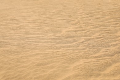Beautiful view of rippled sandy surface in desert as background Photo of Beautiful view of rippled sandy surface in desert as background