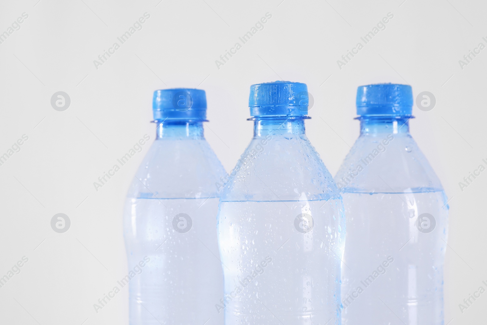 Plastic bottles with pure water on white background Photo of Plastic bottles with pure water on white background