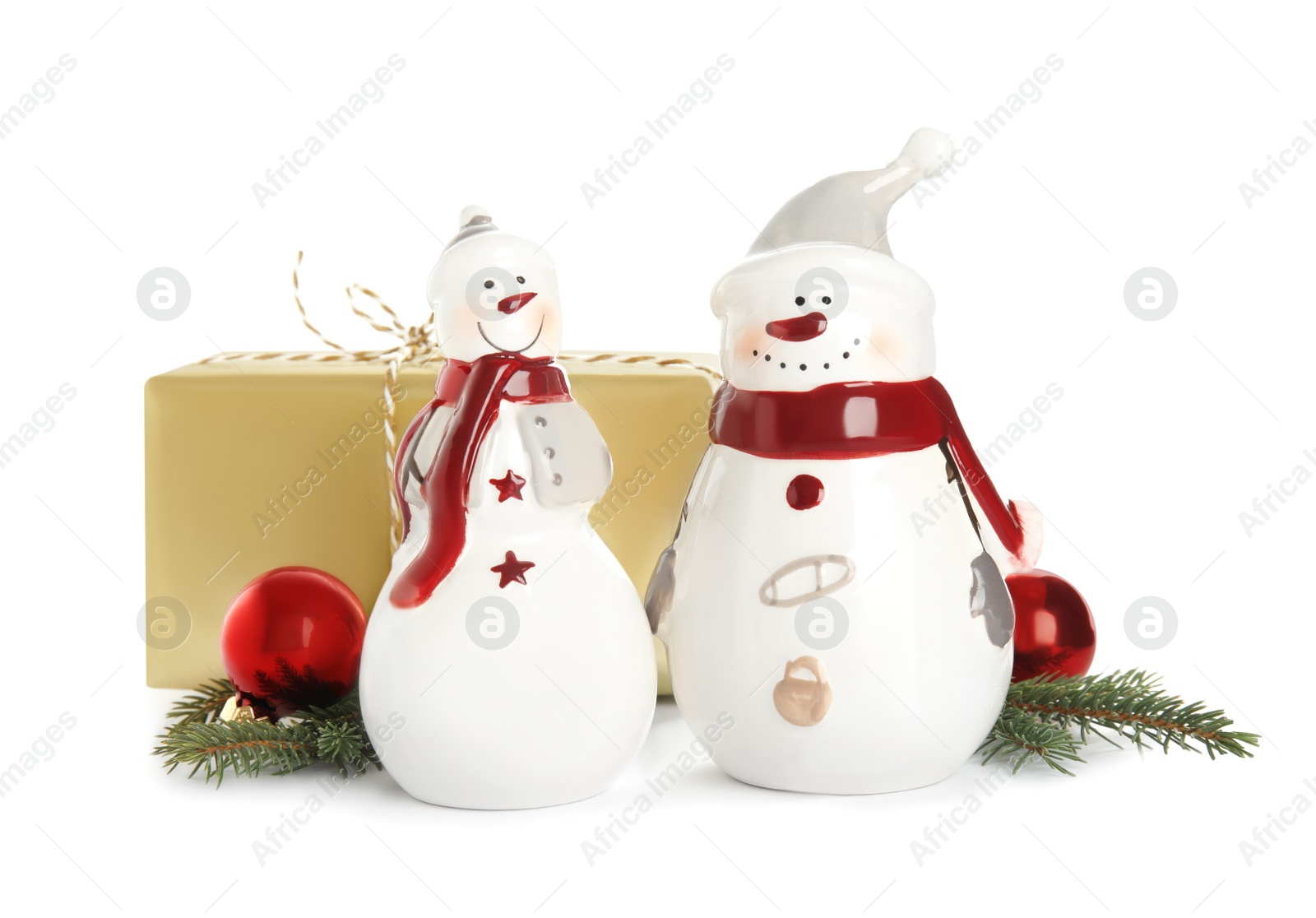 Photo of Christmas composition with decorative snowmen and gift box on white background
