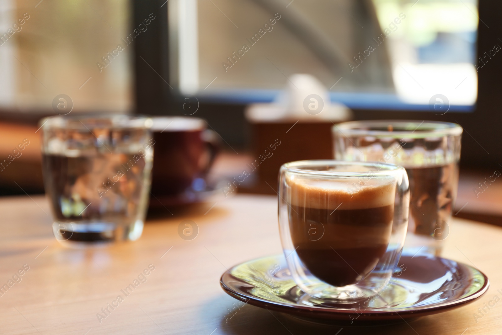 Aromatic coffee on wooden table in cafe. Space for text Photo of Aromatic coffee on wooden table in cafe. Space for text