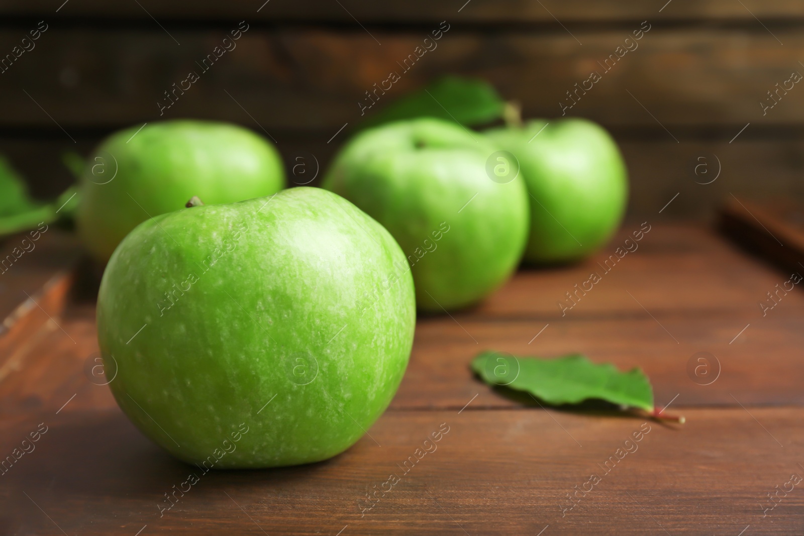 Fresh green apples on wooden background Photo of Fresh green apples on wooden background