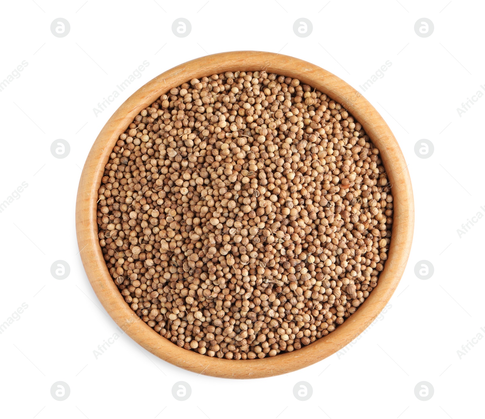 Dried coriander seeds in wooden bowl on white background, top view Photo of Dried coriander seeds in wooden bowl on white background, top view