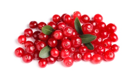Pile of fresh cranberries with green leaves on white background, top view Photo of Pile of fresh cranberries with green leaves on white background, top view