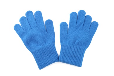 Blue woolen gloves on white background, top view. Winter clothes Photo of Blue woolen gloves on white background, top view. Winter clothes