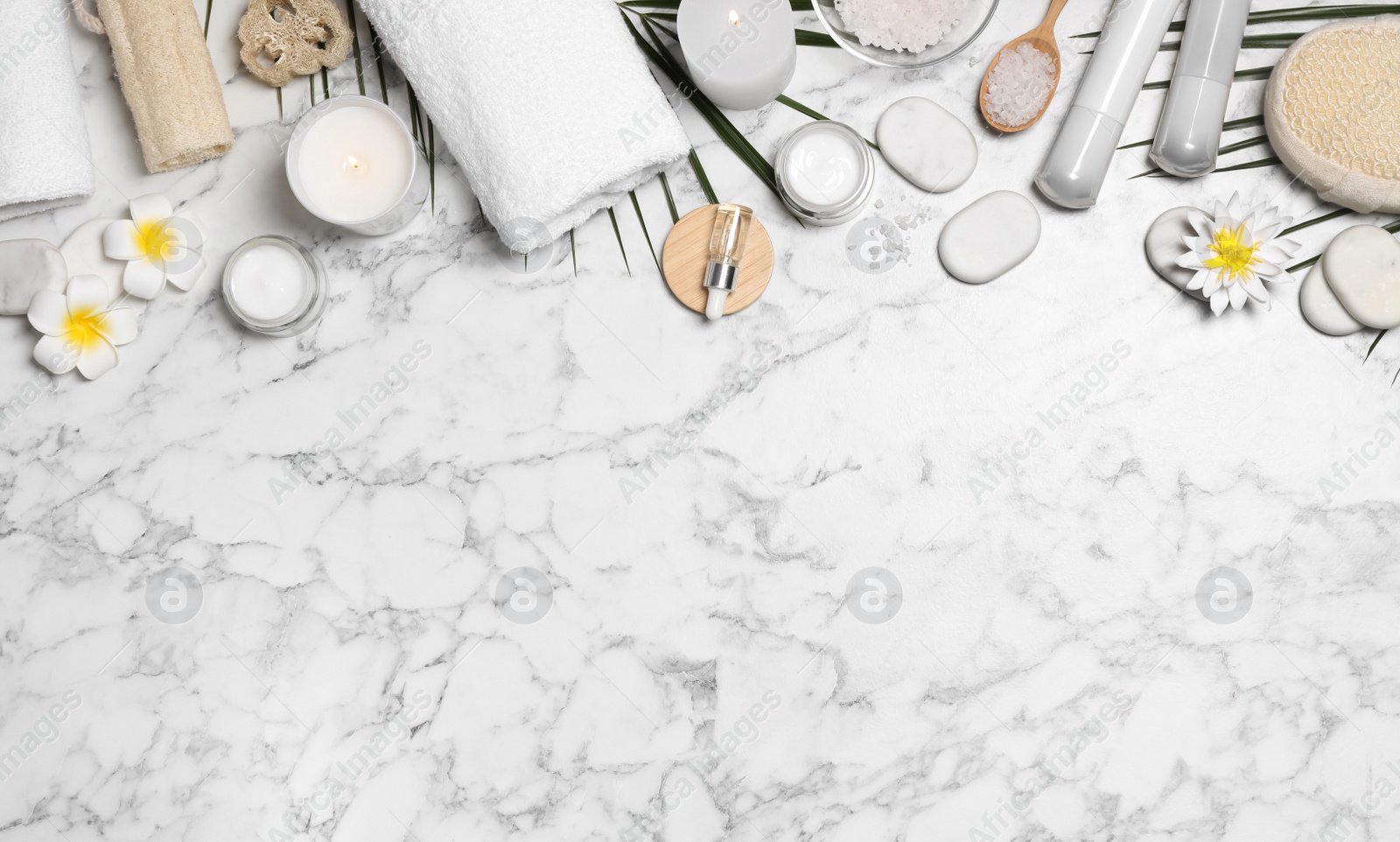 Flat lay composition with spa essentials on white marble background. Space for text Photo of Flat lay composition with spa essentials on white marble background. Space for text