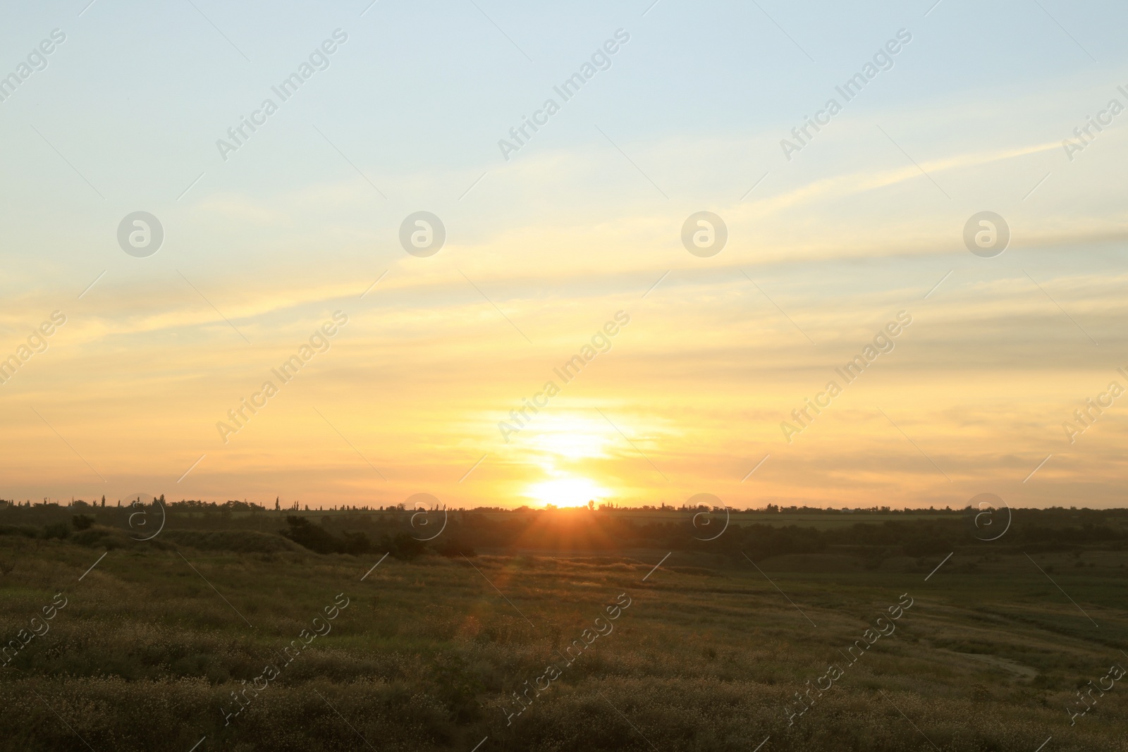 Picturesque view of beautiful countryside sunrise. Early morning landscape Photo of Picturesque view of beautiful countryside sunrise. Early morning landscape