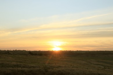 Picturesque view of beautiful countryside sunrise. Early morning landscape Photo of Picturesque view of beautiful countryside sunrise. Early morning landscape