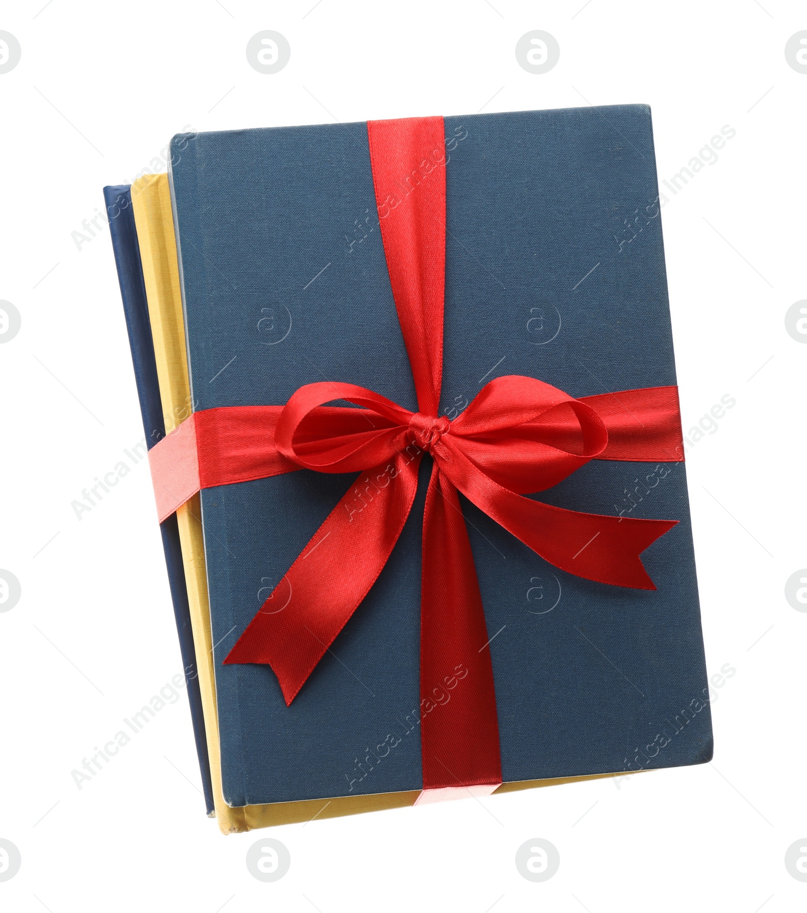 Different books tied with red ribbon isolated on white Photo of Different books tied with red ribbon isolated on white