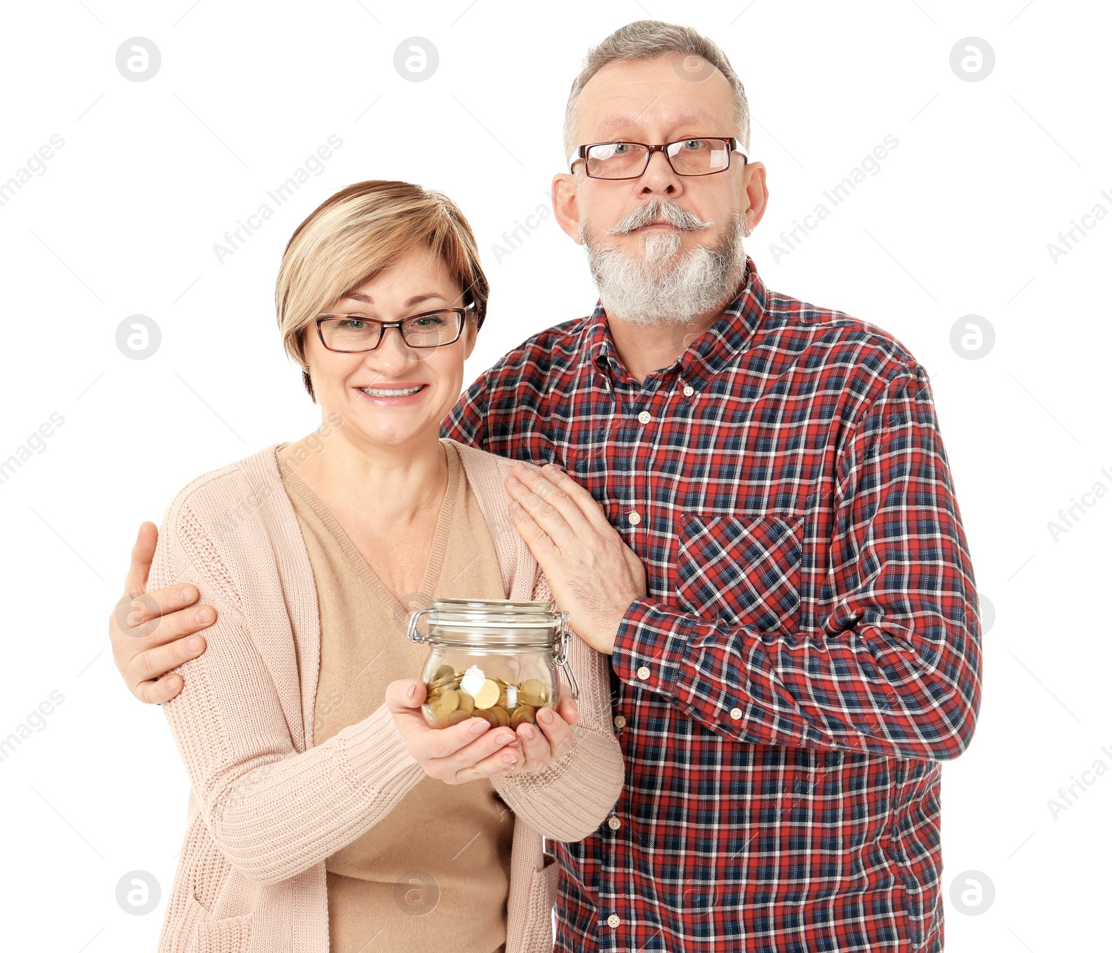 Happy senior man and his wife holding jar with coins on white background Photo of Happy senior man and his wife holding jar with coins on white background