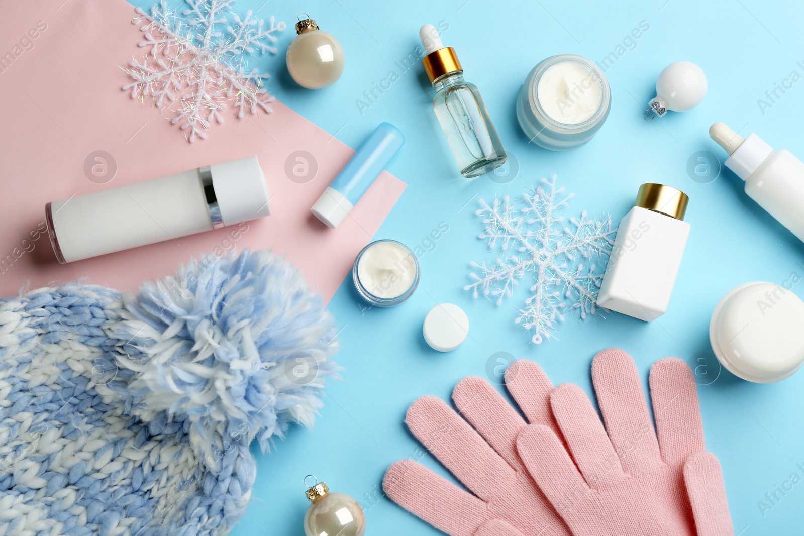 Flat lay composition with different cosmetic products on color background. Winter care Photo of Flat lay composition with different cosmetic products on color background. Winter care
