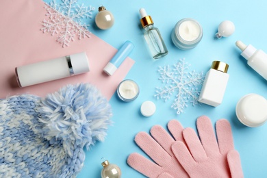 Flat lay composition with different cosmetic products on color background. Winter care Photo of Flat lay composition with different cosmetic products on color background. Winter care